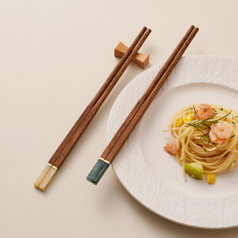 Five pairs of wooden chopsticks for sushi noodles and rice