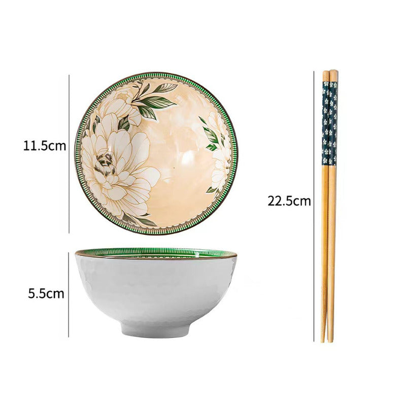 A set of ceramic bowls and chopsticks shown on a white background with dimension labels. The set includes a large bowl with a white exterior and a green rim, a smaller bowl viewed from above showing a beige interior with a large white floral design and green leaves, and a pair of chopsticks with a dark patterned handle and light wood shafts.