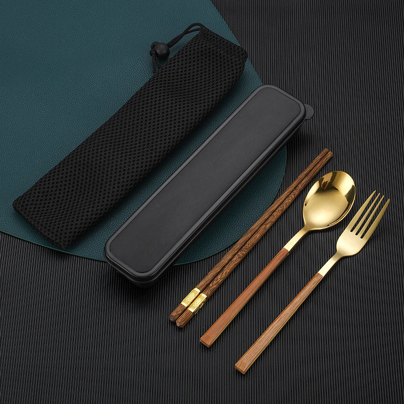 A 4-piece stainless steel cutlery set with brown wooden handles, shown with a black mesh carrying case and a black rectangular case on a dark textured background.