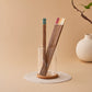 Natural wood chopsticks with red orange yellow turquoise and ivory handles