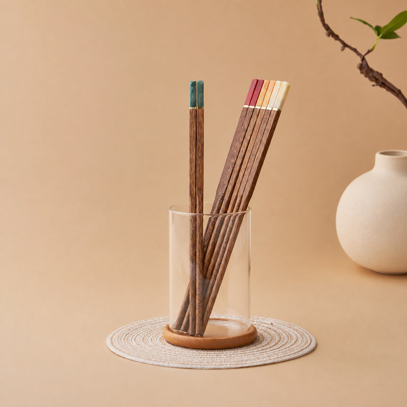 Natural wood chopsticks with red orange yellow turquoise and ivory handles